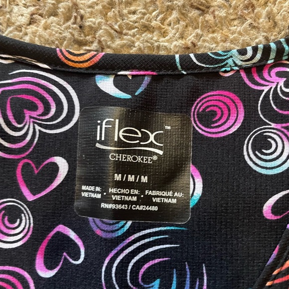 Scrub tops, like new. Sizes on pics, $20 each or all 3 for $50. - Picture 3 of 4